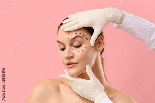Canvastavla Plastic surgery and cosmetic procedure, surgeon hands examining woman face with