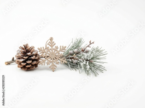 Festive Winter Decorations: Pinecone, Snowflake Ornament, and Frosted Pine Branch