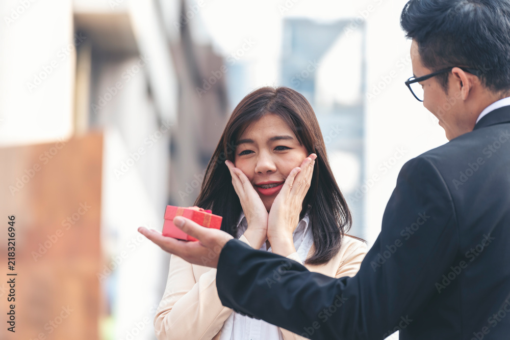 Obraz premium Lover relationship romance romantic partner. Couple lover hands holding red heart concept. Couple hands holding love. Sweet heart boyfriend girlfriend dating engaged affection in love on honeymoon