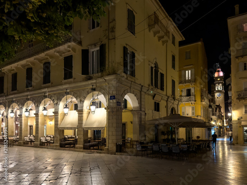 Night view of Liston arcade and Saint Spyridon Church bell tower in Corfu Town, Greece