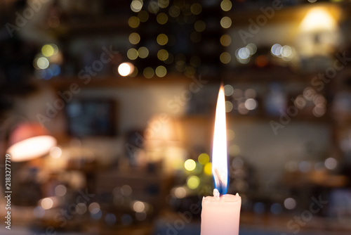 Obraz na płótnie Burning White Candle Against Bokeh Background