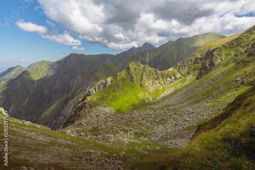 Obraz na plátne Steep rocky scree and mountain slope under a blue sky