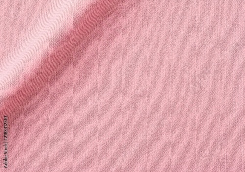 Smooth pastel pink fabric texture background with soft diagonal fold.