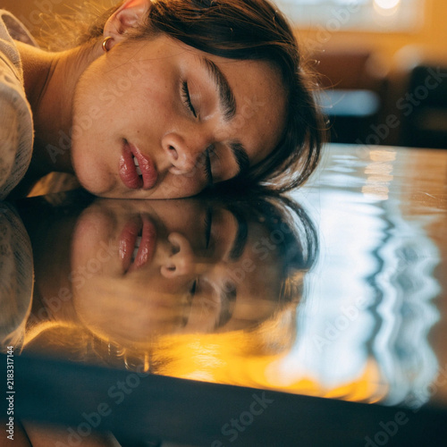 Artistic Female Portrait with Distorted Table Reflection