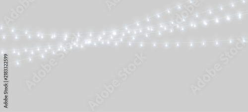 Bild auf Leinwand Several horizontal strings of glowing white bulbs create a festive lighting effect