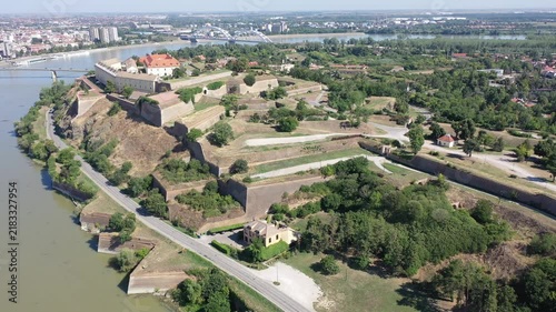 Aerial view of the historic Petrovaradin fortress with the city of Novi Sad in Serbia in the background. Journey through the historical cities of Europe . High quality 4k footage