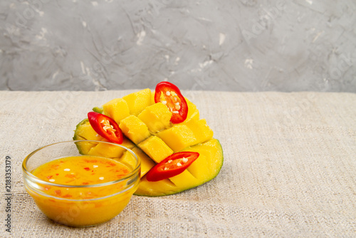 Mango chili sauce, mango and chili on burlap.