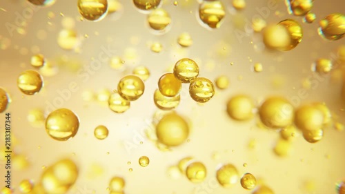 Abstract golden collagen molecules and droplets representing skincare, skin hydration, elasticity, anti-aging, beauty science, rejuvenation and cosmetic innovation.