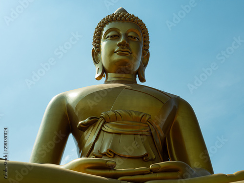 Konstfotografi Golden Buddha Statue Against Blue Sky