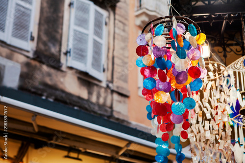 Bild auf Leinwand Greece Colorful handmade wind chime hanging outside a local shop on a charming old street