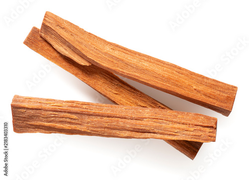 Red sandalwood sticks isolated on white background, top view.