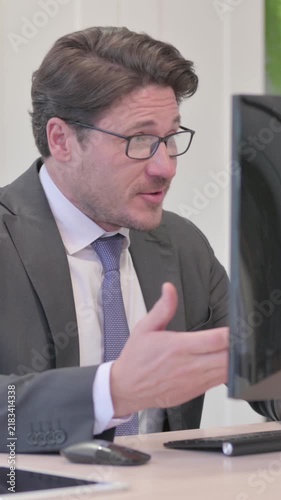 Young Businessman Talking on Video Call on Computer, Vertical Video