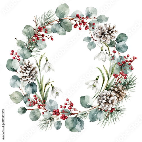 A circular wreath of evergreen branches, snowdrops, and red berries sits against a white background, creating a tranquil winter scene. New Year and Christmas holiday concept.