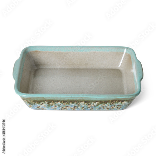 Rectangular ceramic baking dish with orange and cream drip glaze isolated on white background