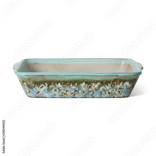 Rectangular ceramic loaf baking dish with turquoise floral glaze isolated on white background