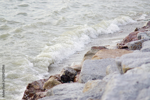 Waves in the sea crash against the rocks