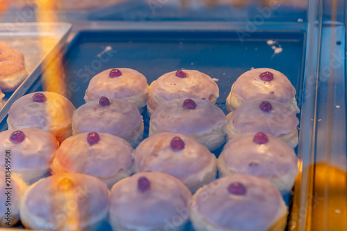 Fresh pastries displayed in a bakery shop during the morning hours