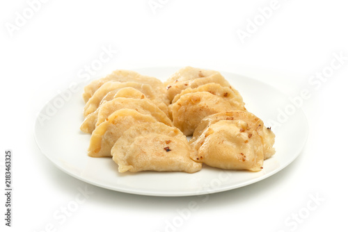 Traditional polish fried potato pierogi on white backgground