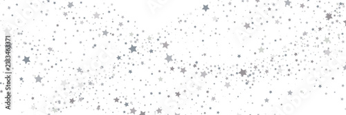 Dispersed wave of large silver stars on white background. Abstract panoramic festive banner with grey confetti. Copy space