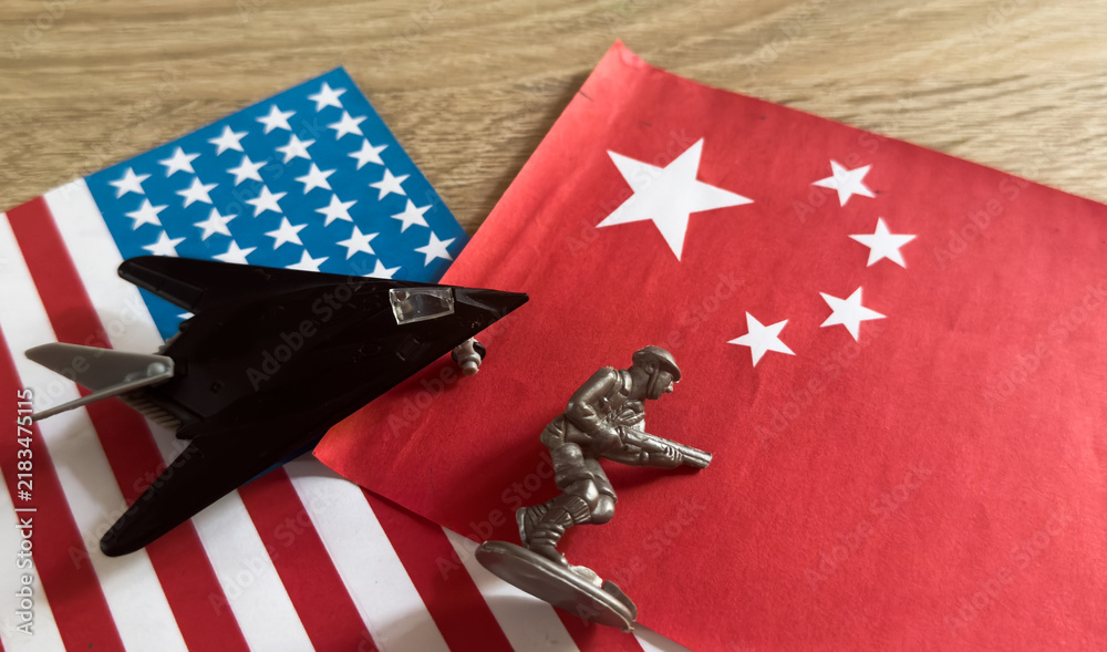 Obraz premium Toy plane with USA and china flag 