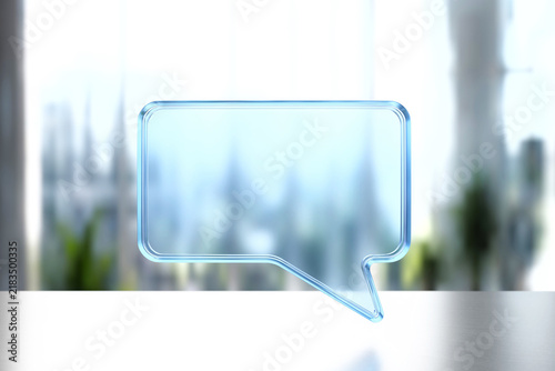 Glass speech bubble on blurred interior background for communication banner and social media wallpaper with translucent frame and modern minimalist design