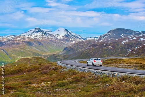 Car driving through Norwegian mountains and landscape, Panorama Road Tindevegen, Norway