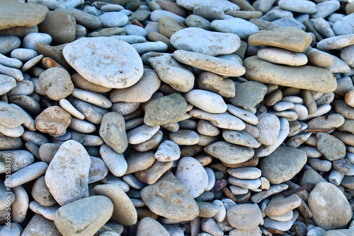 Фотография natural texture of smooth grey and beige pebbles on Toila beach
