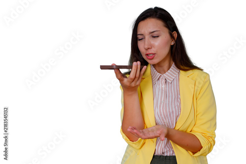 Bild auf Leinwand Young woman recording voice message on smartphone, communicating hands-free with