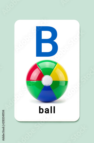 English alphabet flashcard letter B for ball. Educational card with colorful toy ball on mint background for preschool learning, kindergarten, kids literacy and ESL phonics.