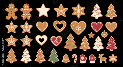 Collection of various homemade gingerbread cookies shaped like stars hearts trees and men on black