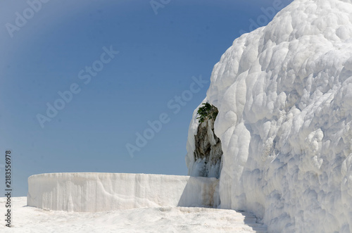 Pamukkale Turkey travertine terraces white mineral formations thermal springs ancient landscape blue sky natural wonder tourism destination geology calcium pools
