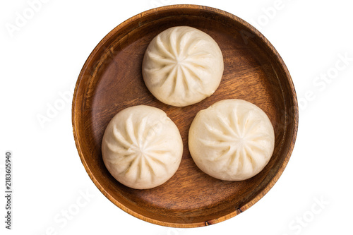 Fotografie Dumpling Momos with pork meat in wooden plate isolated on white background