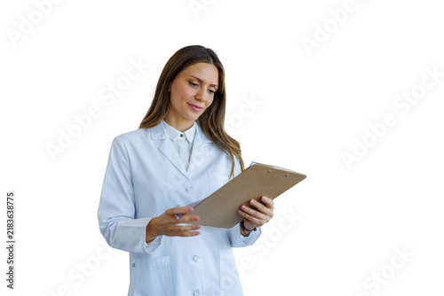 Female healthcare professional reviewing medical information on clipboard