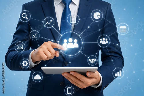 Person in suit interacting with digital team collaboration interface on tablet
