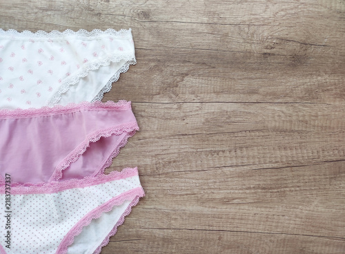 Women's lingerie, elegant cotton panties with lace trim in a flat lay composition, top view