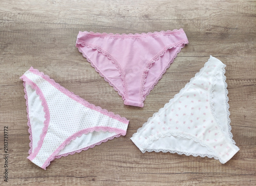 Women's lingerie, elegant cotton panties with lace trim in a flat lay composition, top view
