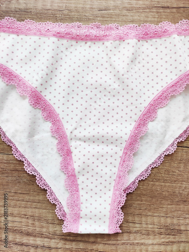 Women's lingerie, elegant cotton panties with lace trim in a flat lay composition, top view