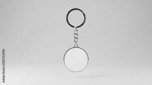 Empty silver round keychain mockup floating against a plain white studio background.