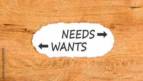 фотографія Needs instead wants words symbol
