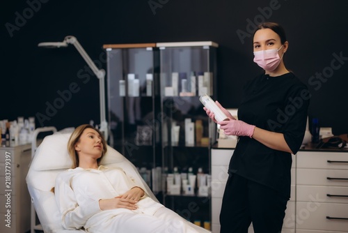 Photography Aesthetician advising client before beauty treatment