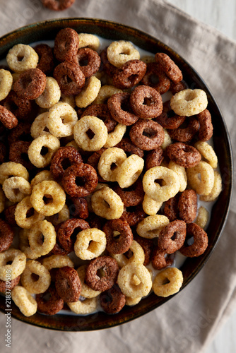 Cuadro en lienzo Healthy Breakfast Cereal with Whole Milk in a Bowl, top view.