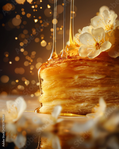 Golden Honey Drizzle Over Luxury Mille Feuille Pastry with White Blossoms and Gourmet Dessert Styling