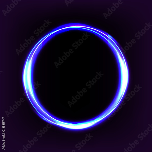 Abstract glowing blue neon circle ring with light trails isolated on a dark black background