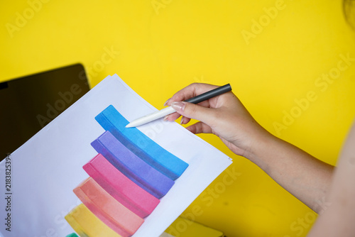 hands of a woman painting a picture