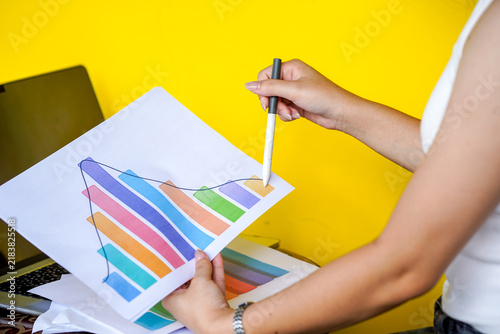 hands of a woman painting a picture