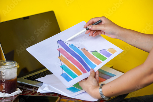 hands of a woman painting a picture