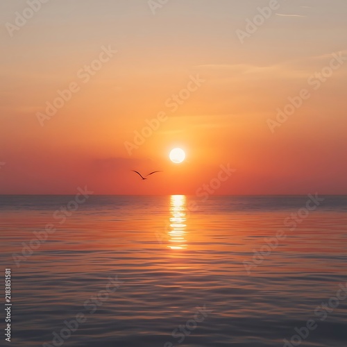 Serene ocean sunset scene sun low horizon warm orange golden glow sky reflection calm water single bird flying silhouette smooth color transition deep orange pink peach peaceful beauty harmony sea sky