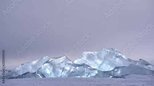 A serene winter landscape with a glistening pile of snow evoking feelings of peace and tranquility
