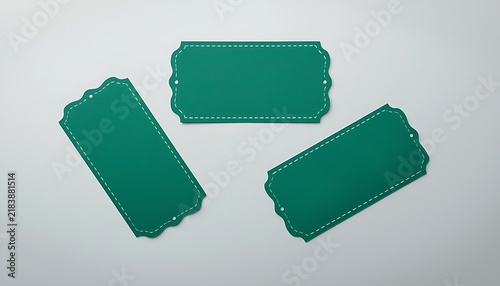 Three teal blue vintage style rectangular tags with stitching patterns.
