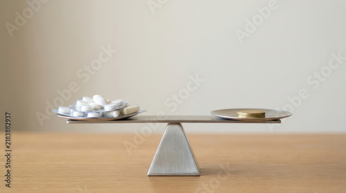 Balance scale illustrates healthcare equity initiatives through unequal access to treatment and resources